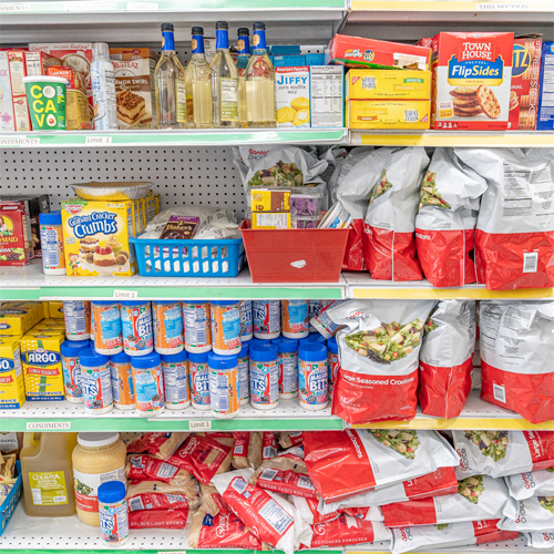 Shelves of Families Matter Food Pantry fully stocked with food items